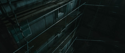 Intruders - ginger tabby cat Meow backing away from scary figure climbing scaffolding towards Juan Izán Corchero animated gif