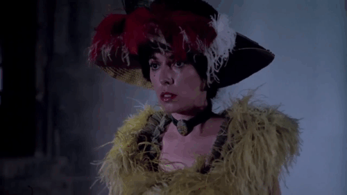 Jack the Ripper - Cynthia Josephine Chaplin walking down street and startled by black cat jumping off barrel animated gif