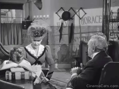 Klondike Kate - Ann Savage sitting with Judge Crossit George Cleveland and small tabby cat Mr. Blackstone animated gif