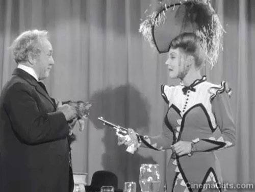 Klondike Kate - Ann Savage pointing gun at Judge Crossit George Cleveland holding small tabby cat Mr. Blackstone who paws at weapon animated gif