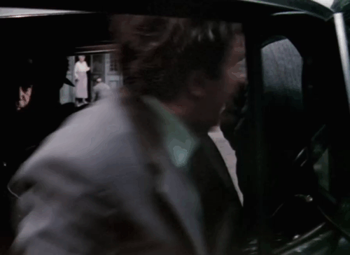 The Ladykillers - tuxedo cat sitting on sidewalk behind Louis Harvey Herbert Lom animated gif