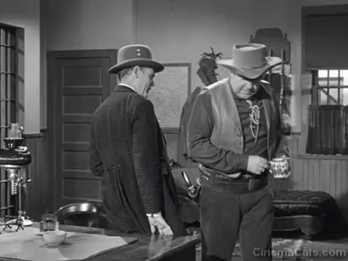 The Last Posse - Sheriff John Frazier Broderick Crawford pouring out cream for tabby cat on desk with Stokley Henry Hull animated gif