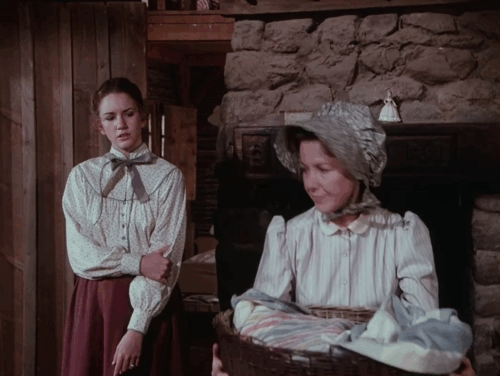Little House on the Prairie - Days of Sunshine, Days of Shadows Part Two - Caroline Karen Grassle walking out door with baby and Laura Melissa Gilbert and black cat following animated gif