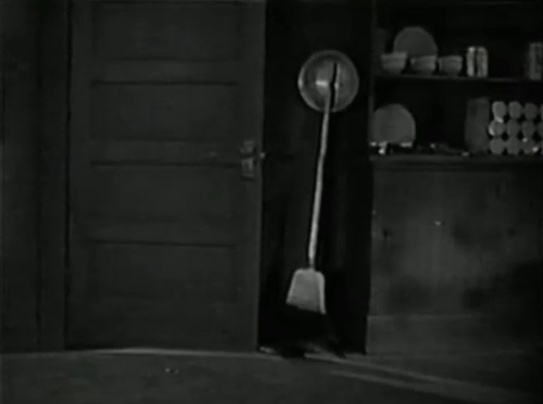 Love Among the Millionaires - longhair black cat being chased by collie dog then pulled up on shelf animated gif