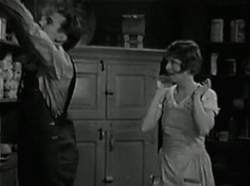 Love Among the Millionaires - Jerry Stanley Smith handing longhair black cat to Pepper Clara Bow animated gif