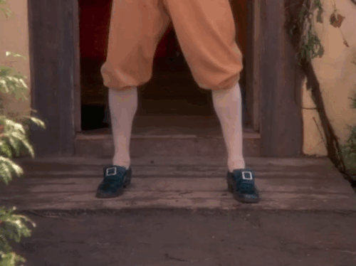 Love at Stake - black cats running out of house past Miles Patrick Cassidy and down path past towns people animated gif