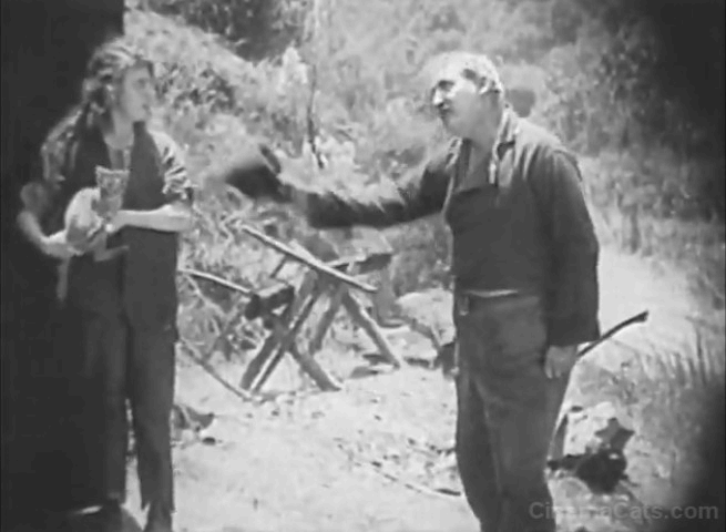 Mickey - Mabel Normand holds tabby cat by tail animated gif