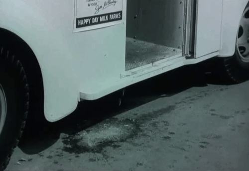 The Milkman - milk spilling from truck with tabby cats running animated gif