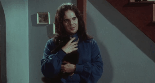 Miss Leslie's Dolls - Miss Leslie Salvador Ugarte holding and talking to black cat Tom animated gif