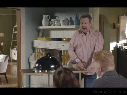 Modern Family - I'm Going to Miss This - Cameron Eric Stonestreet removing cloche to reveal white cat Larry Frosty animated gif