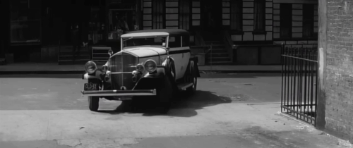 Murder, Inc. - tabby cat moving away from car driving into garage animated gif