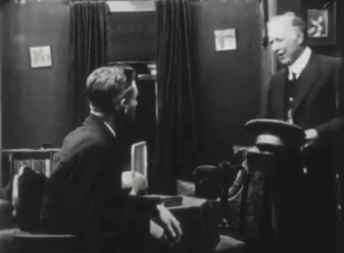 An Old Man's Love Story - tuxedo kitten jumping onto bed behind Cyril Frank O'Neil and Greythorne Van Dyke Brooke animated gif