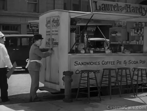 Pack Up Your Troubles - numerous cats leaping out of lunch wagon owned by Laurel and Hardy animated gif