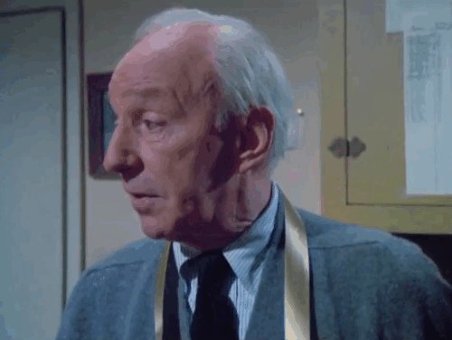 Police Woman - Merry Christmas Waldo - Lloyd Nolan with ginger tabby cat Harry lying on dresser animated gif