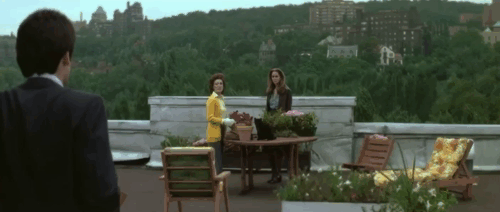 The Pyx - black cat on rooftop table with Meg Yvette Brind'amour and Elizabeth Karen Black animated gif