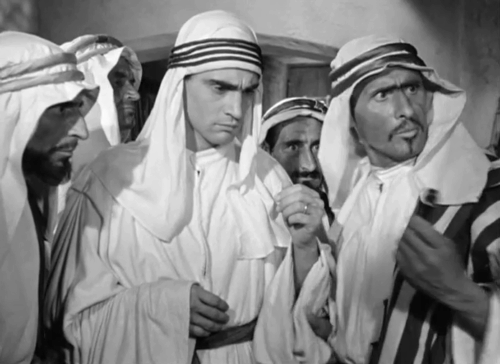 Quel fantasma di mio marito - Gianni Walter Chiari pulling white kitten from the sleeve of his robes with Arabs animated gif