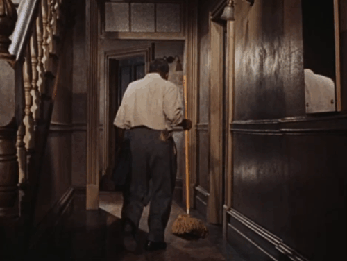 The Rat Race - ginger tabby cat running down apartment hallway past kicking custodian Johnny Lee animated gif