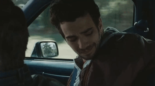 Real Time - Andy Jay Baruchel scratching head of tuxedo cat Cleo in carrier in back seat of car animated gif