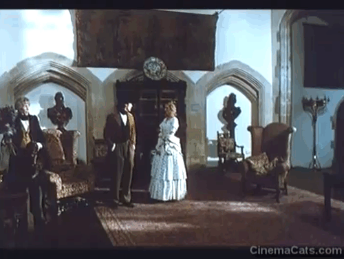 Rebecca's Daughters - Lord Sarn Peter O'Toole throwing brown tabby cat Rover onto chair with Raine Paul Rhys and Rhiannon Joely Richardson animated gif