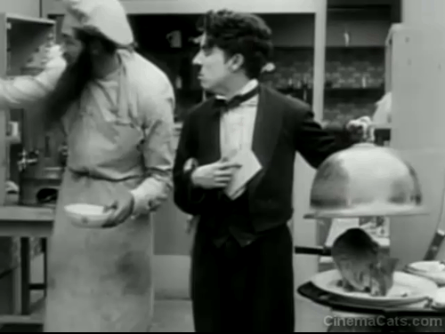 The Rink - Chaplin covering cat and then uncovering cat with cloche animated gif