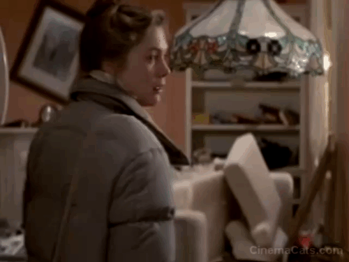 Romancing the Stone - orange and white cat Romeo drops into Joan Wilder Kathleen Turner arms