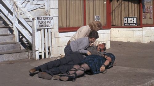 The Russians Are Coming - ginger and white tabby cat being carried into scene, thrown down then walking away from Carl Reiner, Eva Marie Saint and Larry D. Mann animated gif