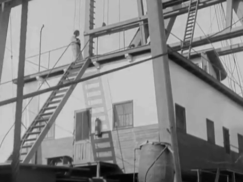 The Salvation Hunters - Georgia Hale dropping black cat then following down steps on boat animated gif