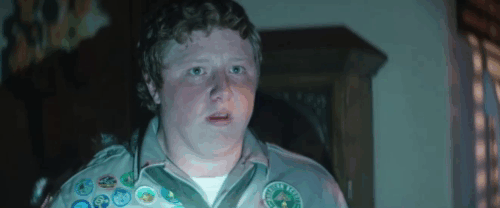 Scouts Guide to the Zombie Apolcalypse - Ben Tye Sheridan warning Augie Joey Morgan as faux white Persian cat zombie climbs on shoulder animated gif