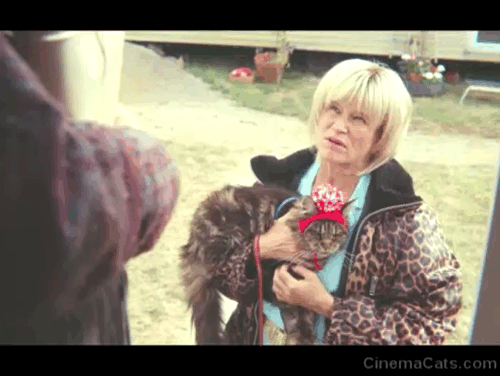 Sexual Education - Episode 1.8 - Cynthia Lisa Palfrey at door of Maeve Emma Mackey with longhair tabby cat Jonathan in knitted cap animated gif