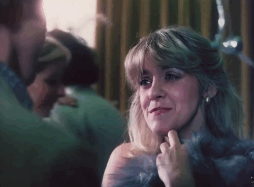 Sex with the Stars - Brenda Aquarias Terri Mitchell holding longhair dilute tortoiseshell cat with Peter Martin Burrows animated gif