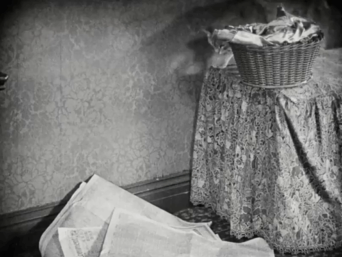 Silence - tabby cat jumping from table onto newspapers startling Jim H.B. Warner with Norma Vera Reynolds animated gif