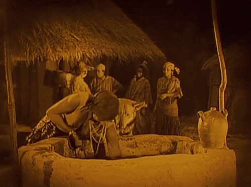 Siren of the Tropics - Papitou Josephine Baker rescuing little tabby cat from well with dog Bamboula animated gif