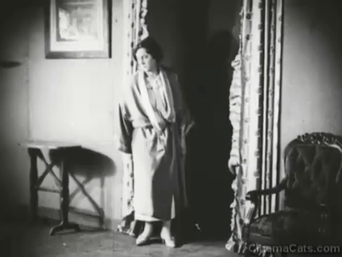 The Smiling Madame Beudet - tabby and white cat entering room and startling Madame Beudet Germaine Dermoz animated gif