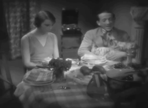 Un soir de rafle - Dragnet Night - aggravated silver tabby cat Bobby being cradled like baby by Fred Jacques Lerner with Mariette Annabella animated gif