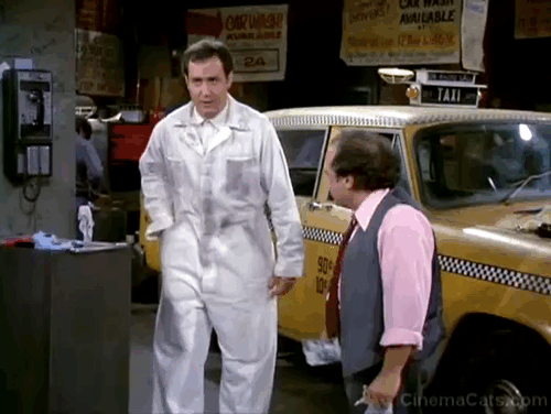 Taxi - Nardo Loses Her Marbles - Latka Andy Kaufman pulls kitten from pocket with Louie Danny DeVito animated gif