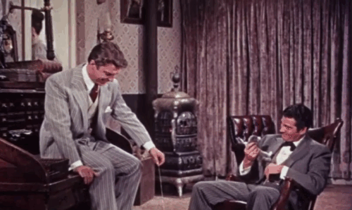 Those Redheads from Seattle - Johnny Gene Barry scratched by grey and white tabby kitten with Joe Guy Mitchell sticking finger in box to get scratched too animated gif