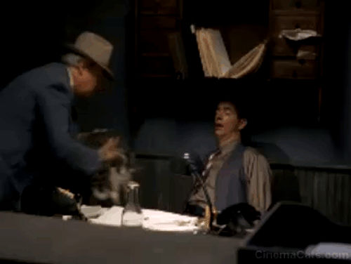 The Trip to Bountiful - Sheriff Richard Bradford placing tabby and white cat on sleeping Roy Kevin Cooney scaring him animated gif