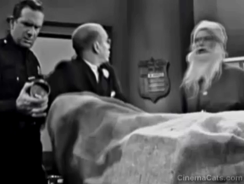 The Twilight Zone - The Night of the Meek - tabby cat being pulled out of bag by Mr. Dundee John Fiedler with Henry Art Carney and Flaherty Robert P. Lieb animated gif