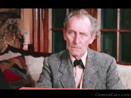 The Uncanny - Gray Peter Cushing looking accusingly at white Persian cat Sugar animated gif