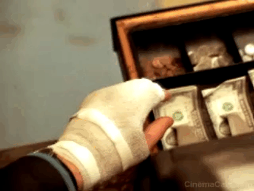 U Turn - tabby cat Chester jumps up on cash register drawer startling Bobby Sean Penn