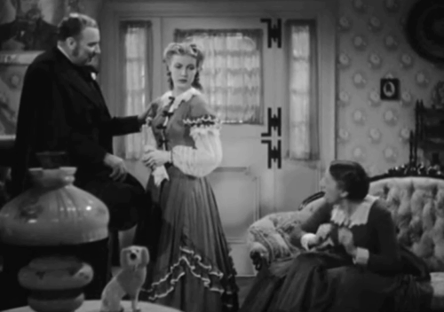 The Villain Still Pursued Her - tabby cat arching back and hissing as Cribbs Alan Mowbray takes leave of Mrs. Wilson Margaret Hamilton and Mary Anita Louise animated gif