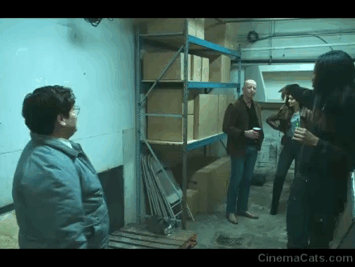 What We Do in the Shadows - Manhattan Night Club - Guillermo Harvey Guillén in Familiar room with Colby introducing Amalta, Mischa, Jameson and gray and white cat Sam animated gif