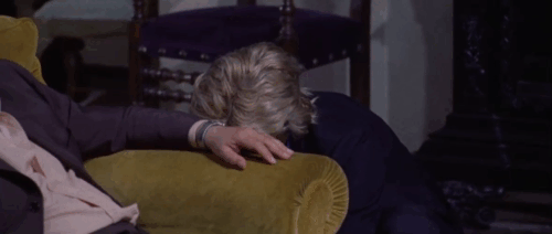 A White Dress for Marialé - Massimo Ivan Rassimov picking up then dropping brown tabby cat animated gif