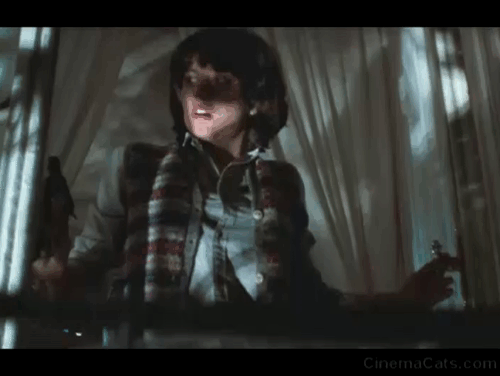 Wolfen - Rebecca Diane Venora scared by longhaired ginger tabby cat on balcony animated gif