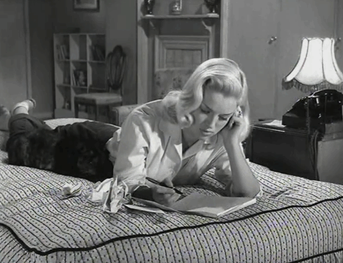 Yield to the Night - Mary Diana Dors lying on bed with tortoiseshell cat animated gif