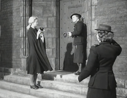 Yield to the Night - Mary Diana Dors handing tuxedo cat to Barker Joan Miller who carries the kitty away animated gif