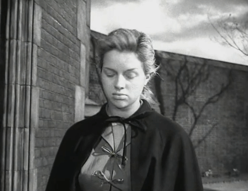 Yield to the Night - Mary Diana Dors turning to go inside prison as tuxedo cat moves away and sits by wall animated gif