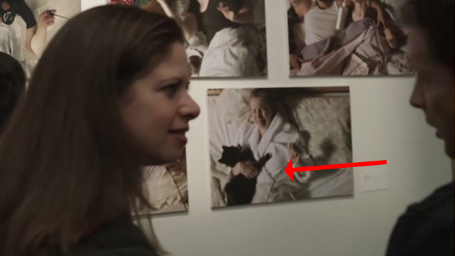 2 Days in New York - long-haired black and white cat Jean Luc on bed with Marion Julie Delpy in photo