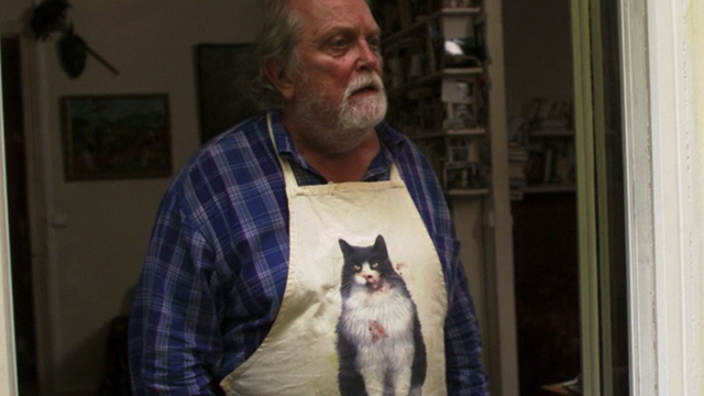 2 Days in Paris - Jeannot Albert Delpy wearing tuxedo cat apron