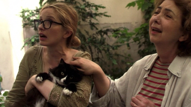 2 Days in Paris - Marion Julie Delpy still holding tuxedo cat Max with Anna Marie Pillet